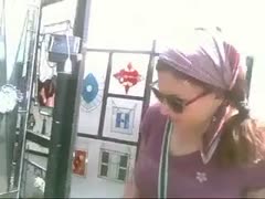 In a secret webcam episode, a pigtailed sweetie at a fair shows her trousers.